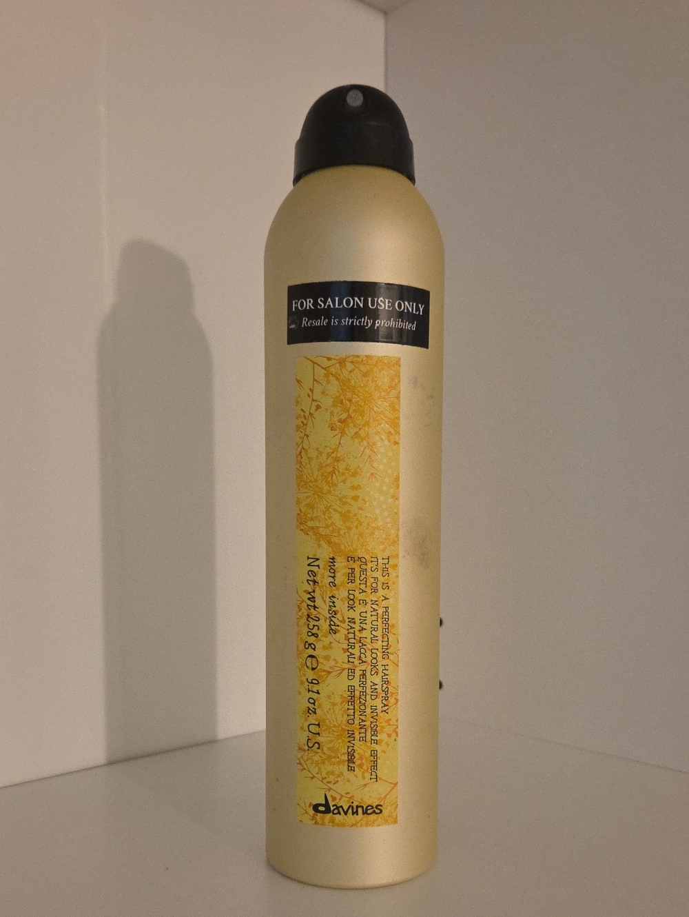 Davines Yellow and Black Hair Spray Bottle